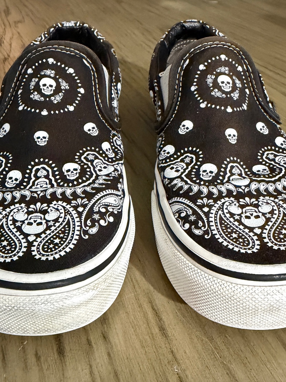 Vans Kids Slip-On Sneakers in Brown and White Skull Bandana Print